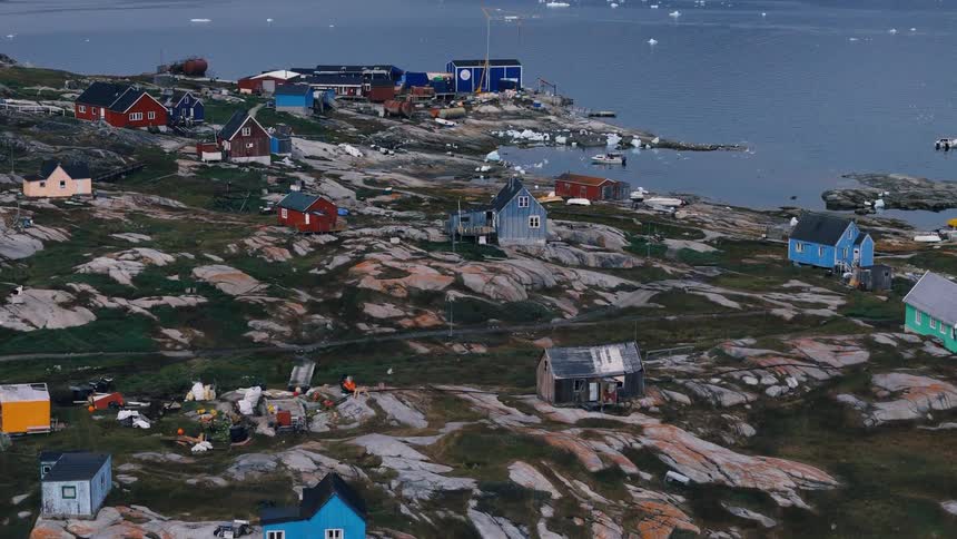 Houses dot the open coast