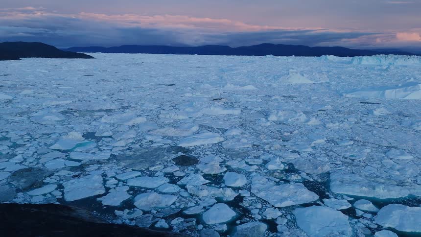 Pieces of broken and melting ice along the arctic coast