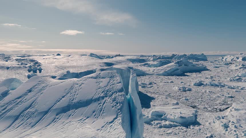 The sun is shining on the arctic landscape
