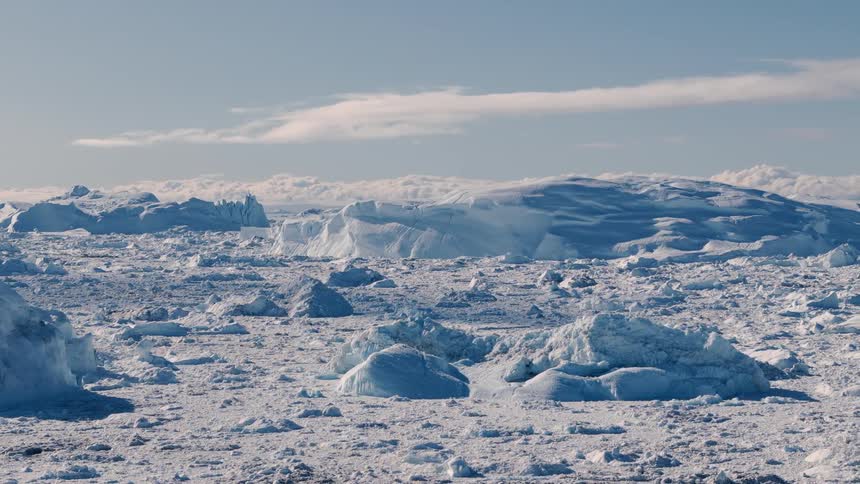 Sunlight shines on snow and ice across the arctic