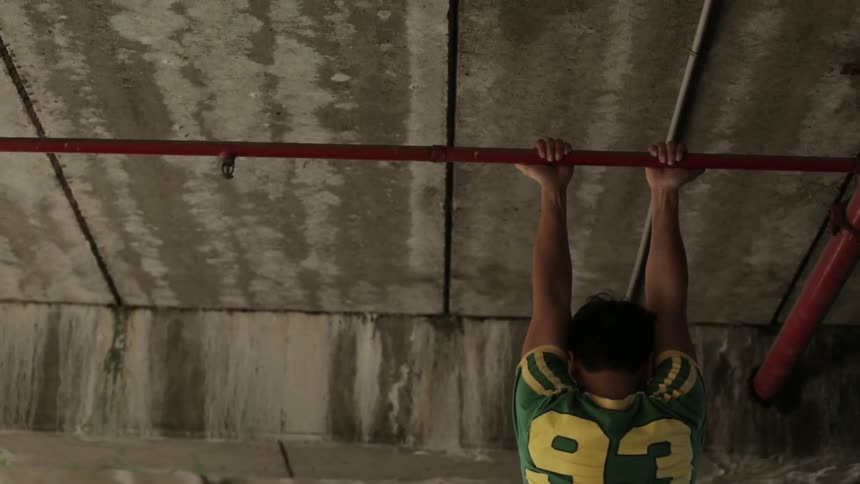 Man performing pull ups