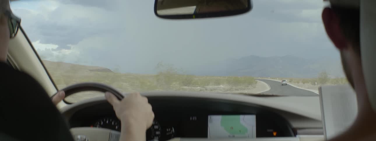 Person driving through the desert