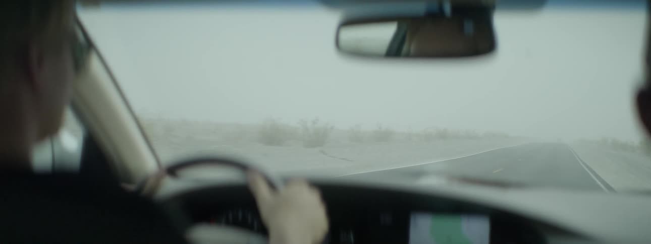 Person driving a car on a foggy day