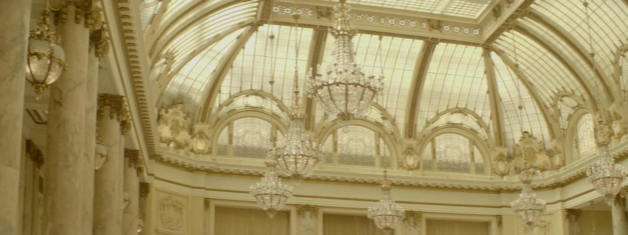The ceiling is lined with chandeliers