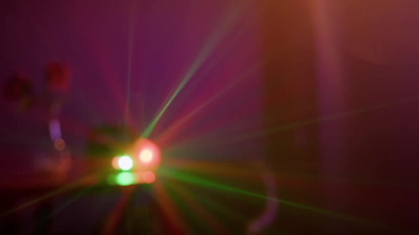 Machine projects colored beams of light indoors