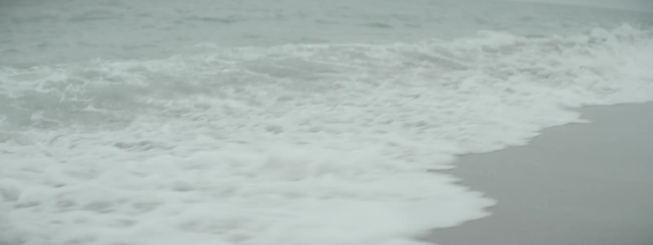 Waves crash against the shore