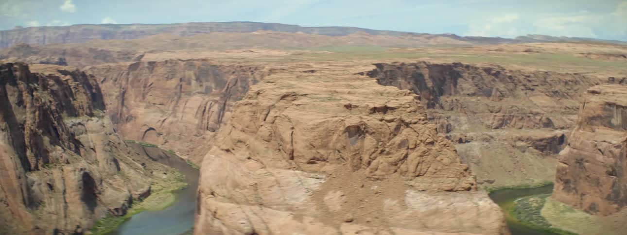 The mountain ahead is lined with water below
