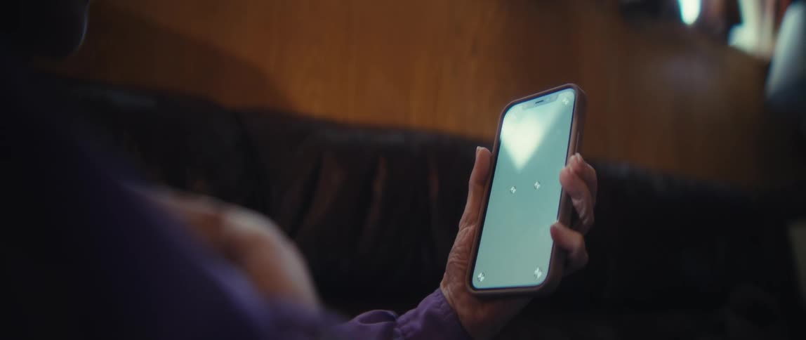 And woman is sitting and looking at her cellphone