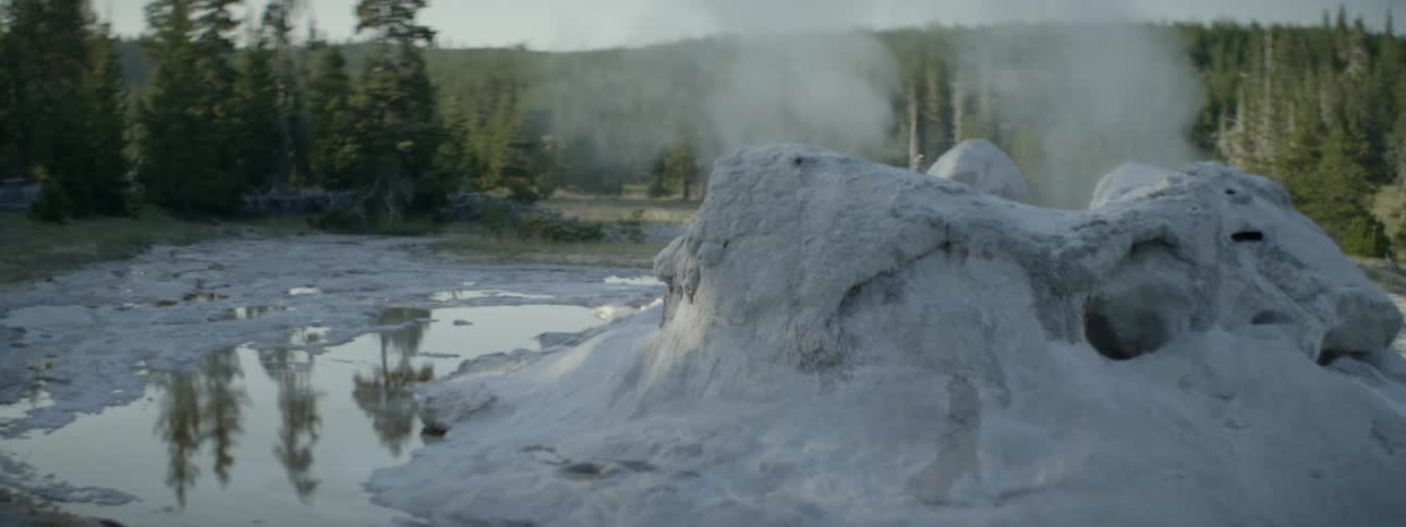 A small crevice in the water is giving off steam