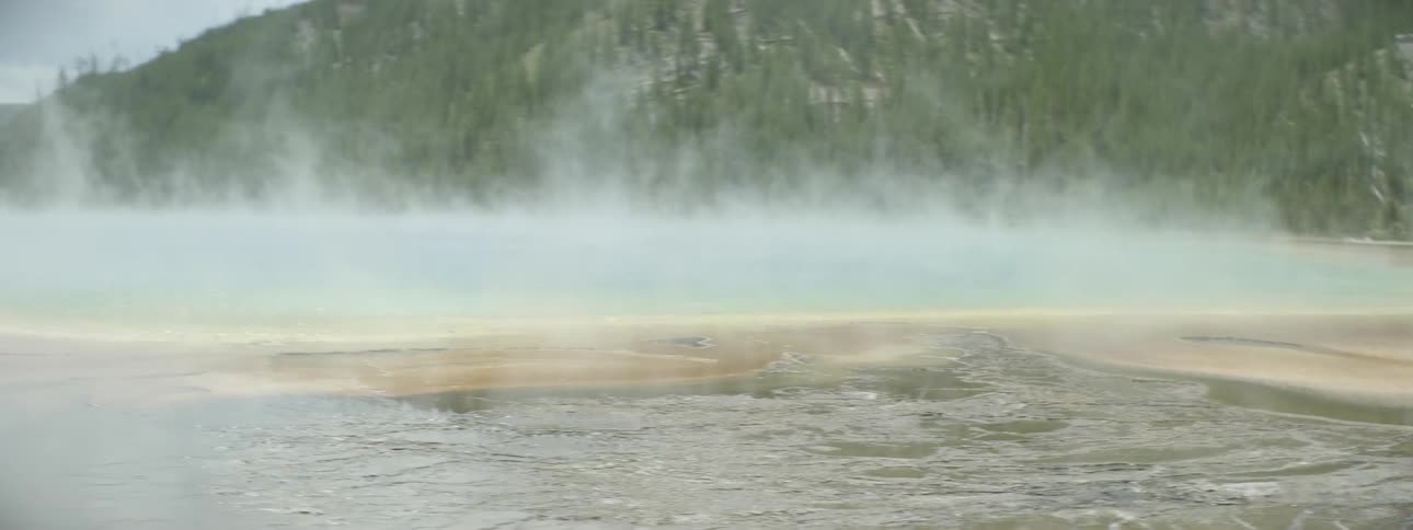 Steam rises from hot springs