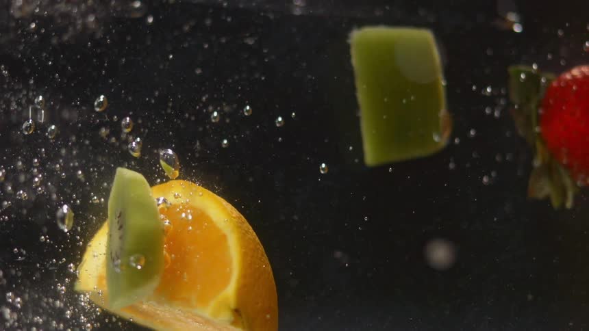 Pieces of fruit move around in the water