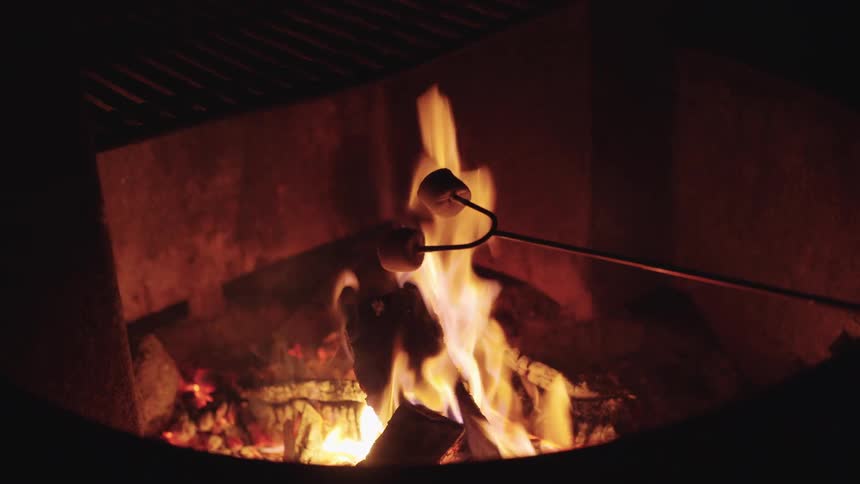 Roasting marshmallows over a fire