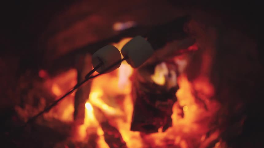 Roasting marshmallows over a fire