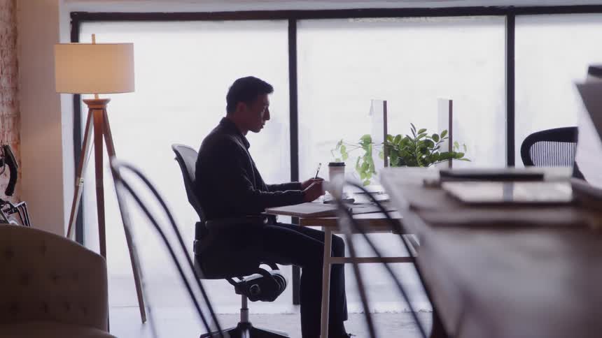 The man is working in the office