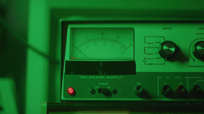 A person turns a machine on