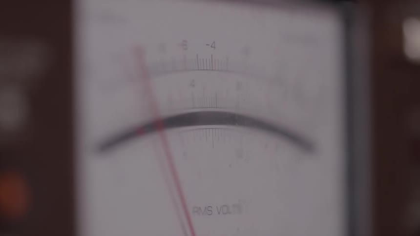 A meter with the needle going back and forth