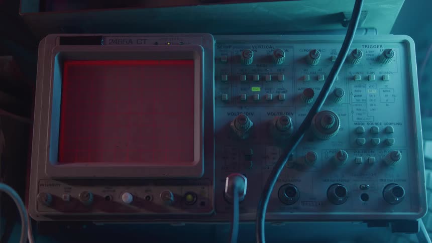 A machine with knobs and dials and a screen