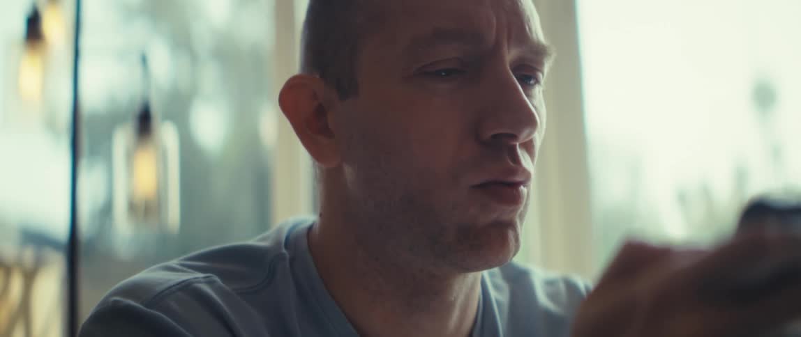 A man playing a game on his cellphone