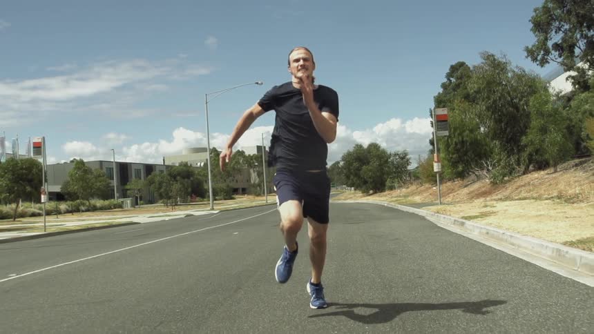 A man running down a street