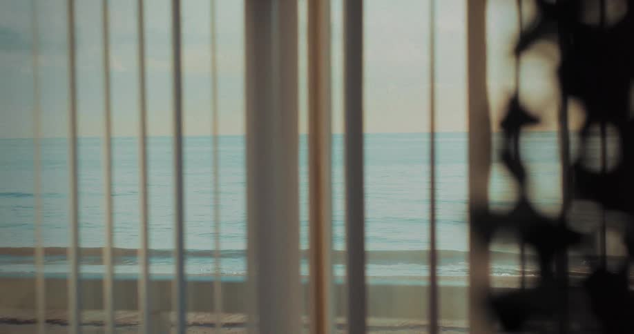View of the ocean from inside a waterfront hotel