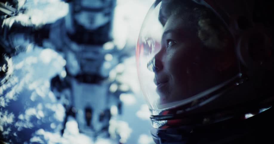 Astronaut gazes up at an approaching space station with Earth in the background
