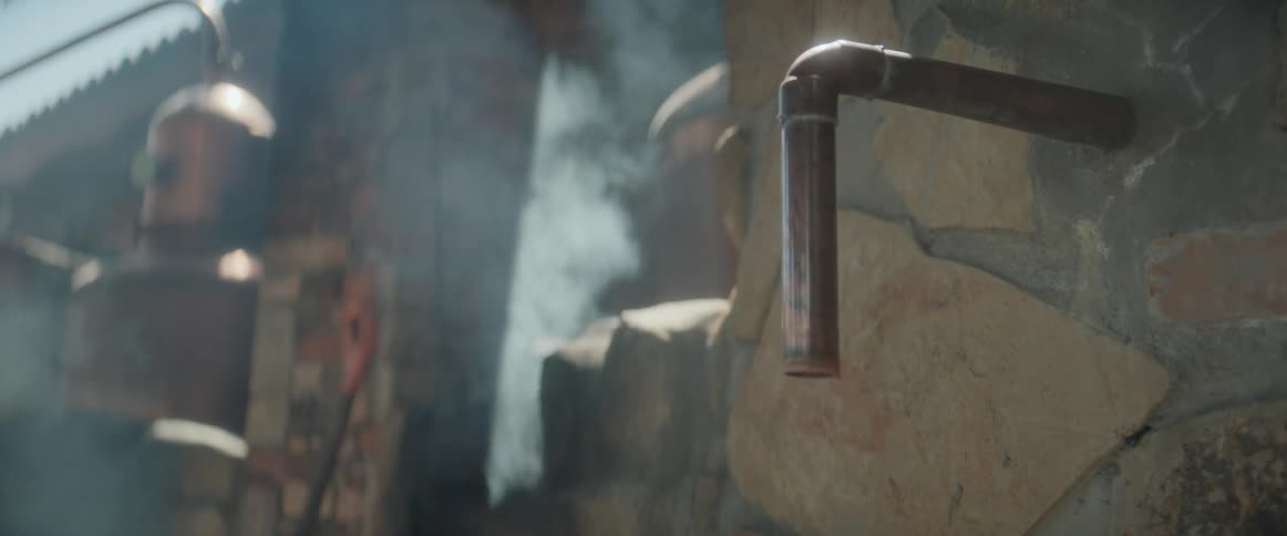 Distillation pipe releases steam in a traditional distillery