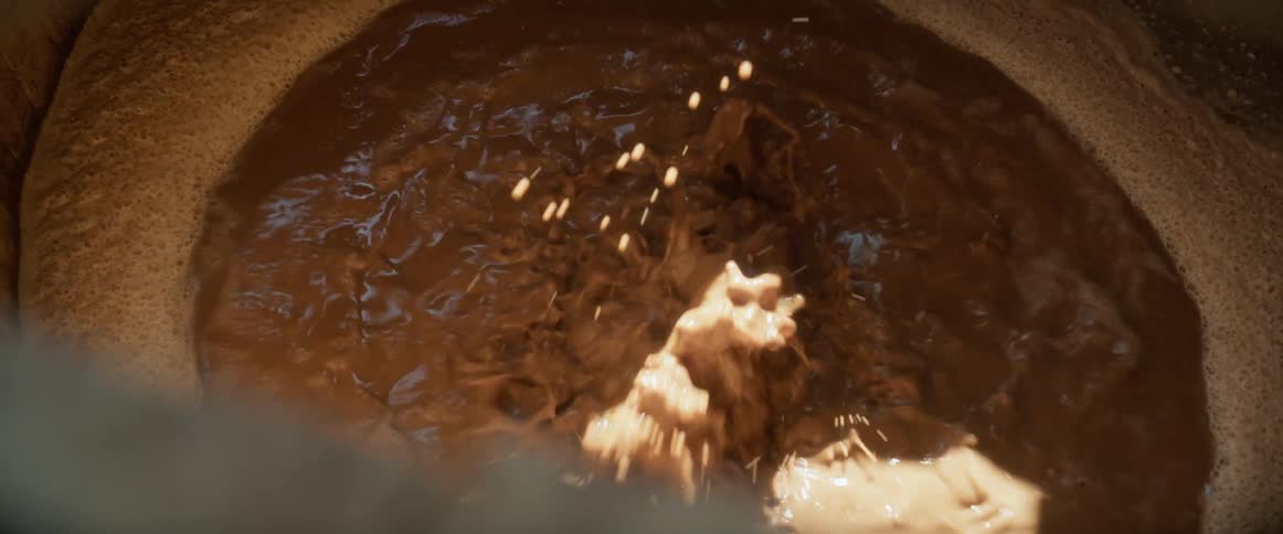 The beer is boiling in the container