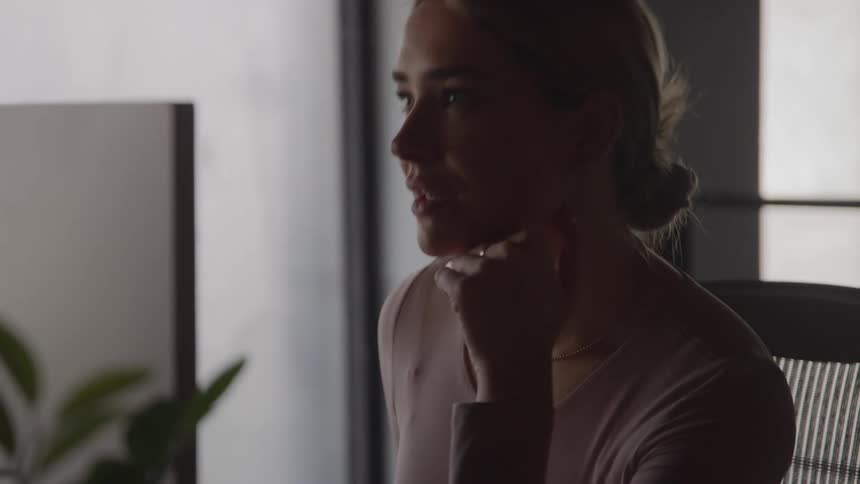 Woman focused looking ahead under soft light