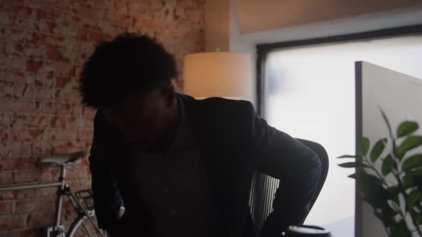 Man sits at an office desk