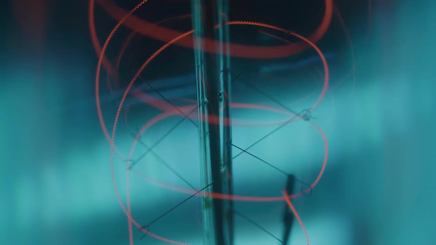Reddish spiral filament fading as the light goes out
