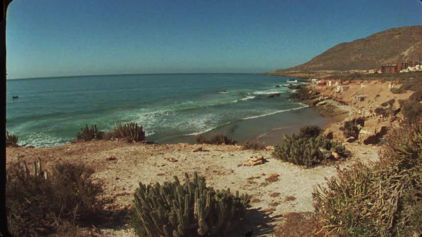 Waves hit the small beach