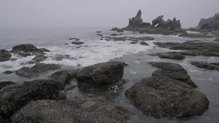 Water moves and crashes against the rocks