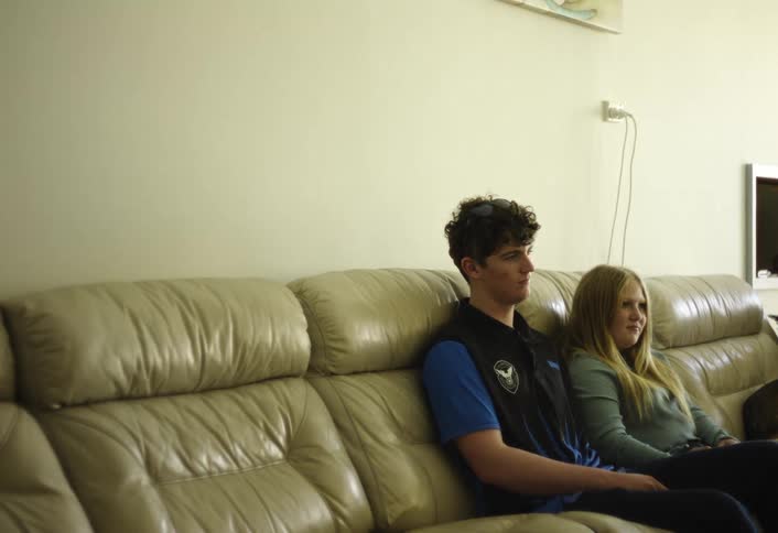Young couple sitting together on the couch
