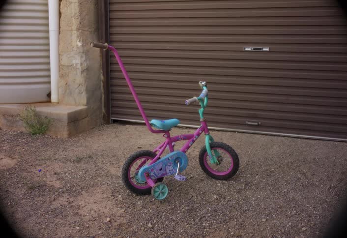 The childrens bike has training wheels