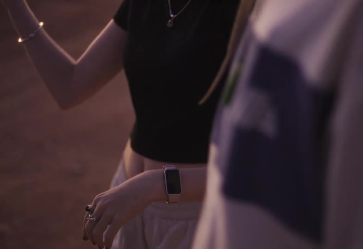 Casual conversation at dusk focusing on gesturing hands