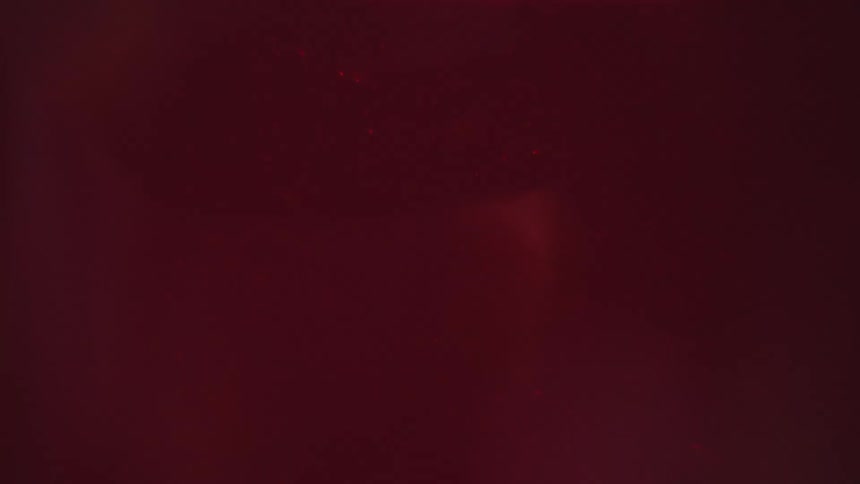 Red diamond glowing within a dark liquid