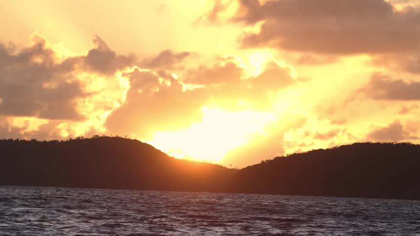 A view of the sun setting over some water