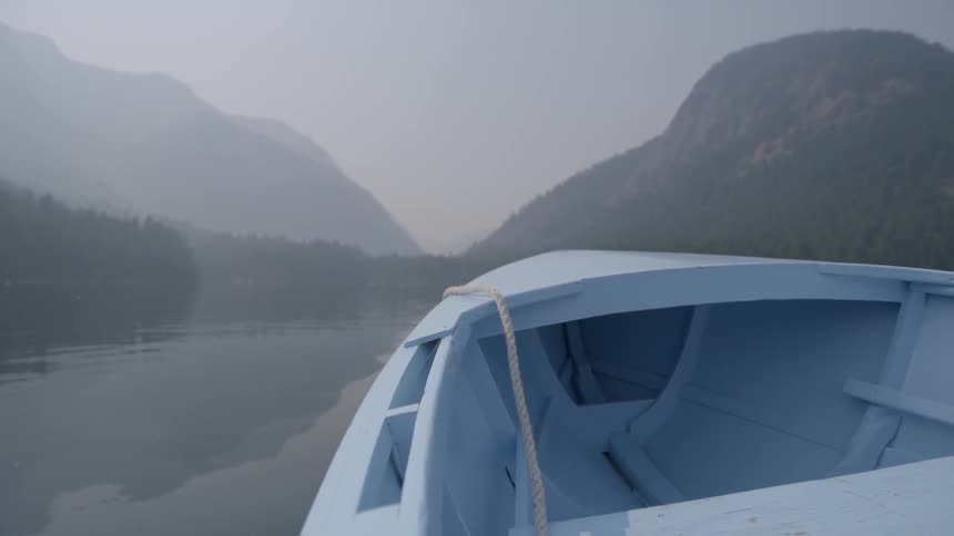 A boat's prow moves through the water