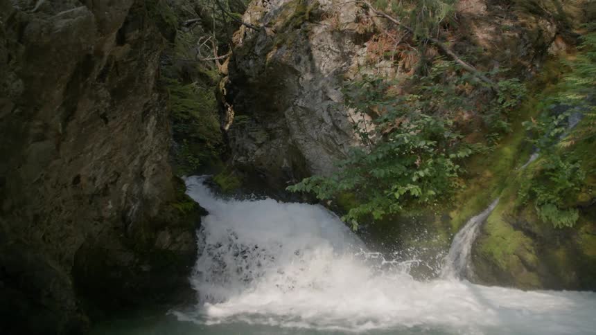 Water rushes down a mountain stream
