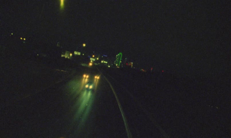 The traffic flows on the freeway at night