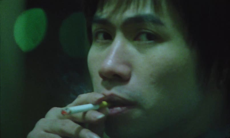 A young man smoking a cigarette
