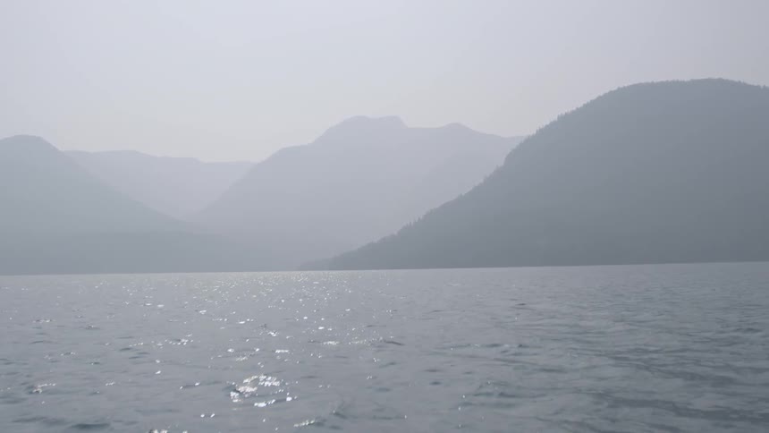 A lake is surrounded by mountains