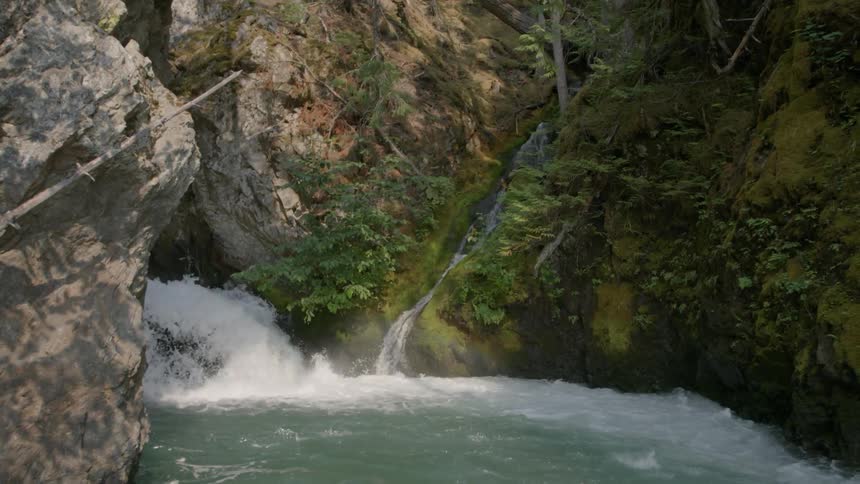 Waterfall splashing out of a rock formation