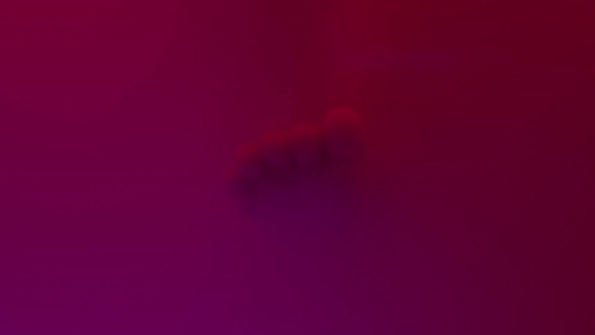 A foot floating in red light