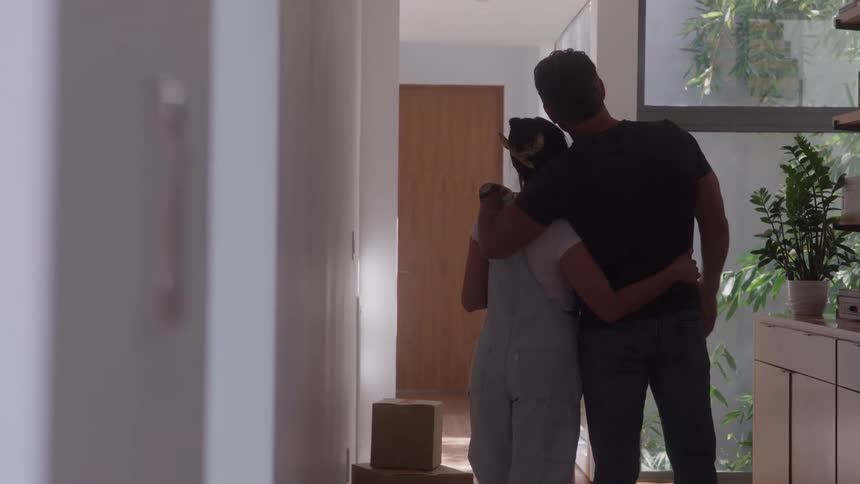 A man and a woman hugging and planning something