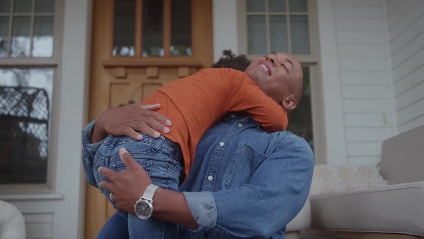 A father hugging his son