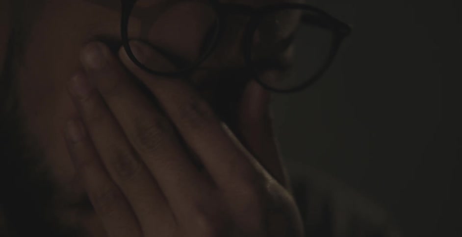Close up of a man's face wearing glasses