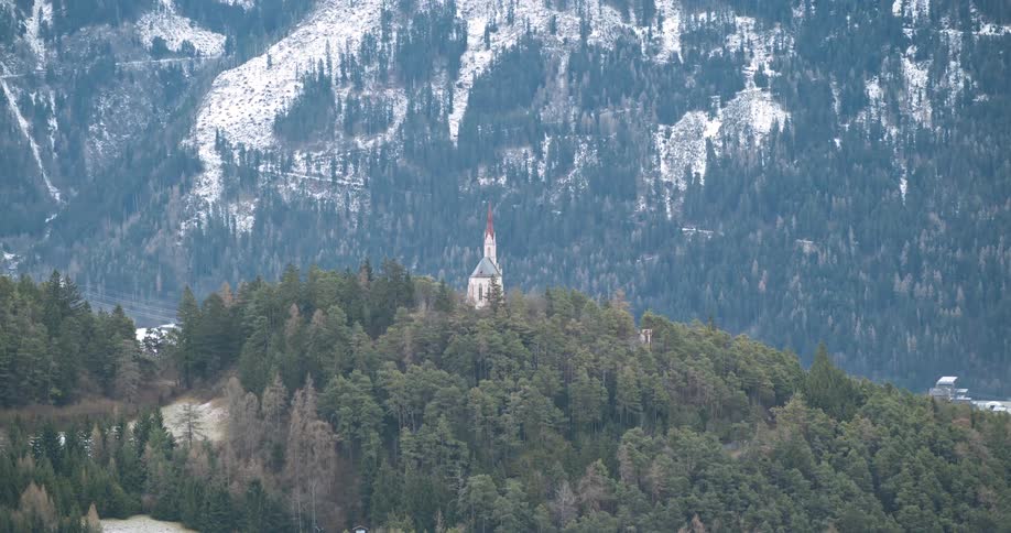 Church on top of a forested mountain