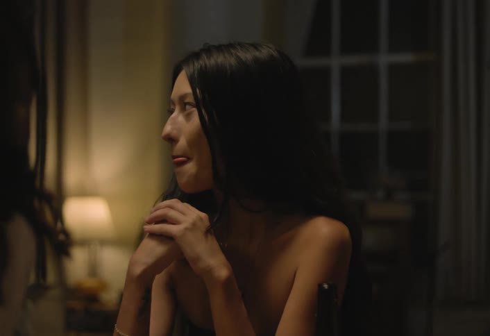 A portrait of a woman in a room at night