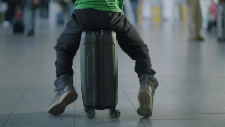 Some people walking in an airport